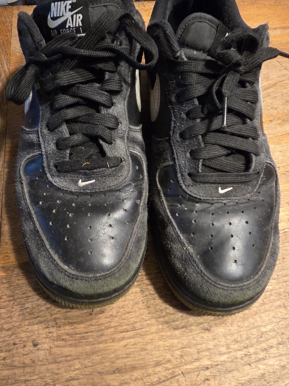 Nike Air Force 1 Men's Black Low-Top Sneakers with White Swoosh